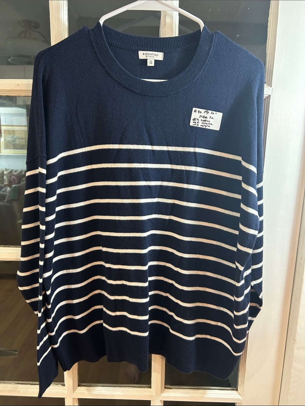 A40.    Reitmans Essentials Navy and White Striped Crewneck Sweater